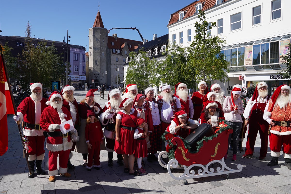 Christmas comes early as hundreds of Santas gather for an unusual summer tradition