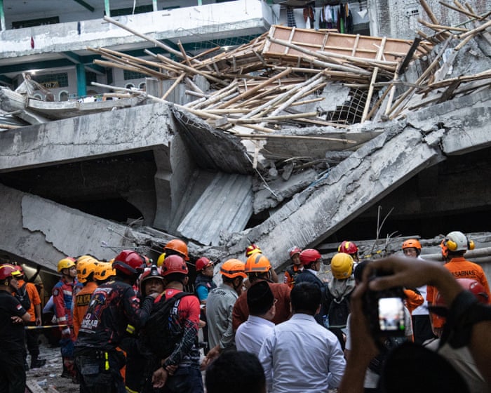 Indonesia school collapse: 91 missing and three dead as rescuers search rubble for second day