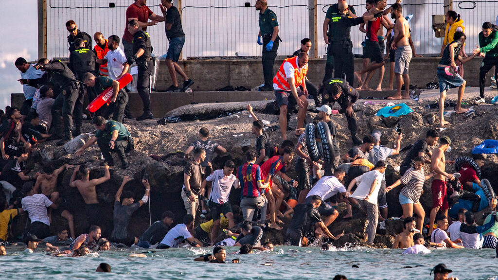 'Humanitarian emergency' as influx of migrants overwhelms Spanish enclave Ceuta