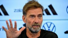 Klopp starts Germany reign by threatening to quit