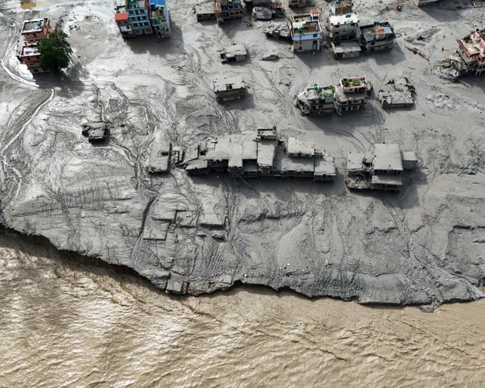 Nepal flash flood: death toll nears 400 amid warning of fresh danger from rising lake water – latest updates