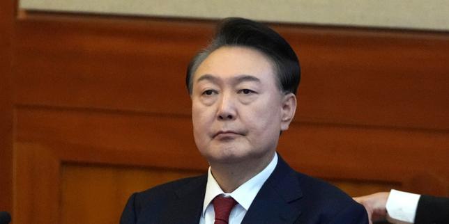 South Korea's Yoon sentenced to two years over illegal opinion polls scheme