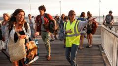 Tens of thousands evacuated from French tourist spot and near Madrid as wildfires spread