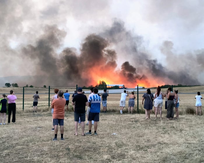 France and Spain race to control wildfires as more than 250,000 evacuated – live