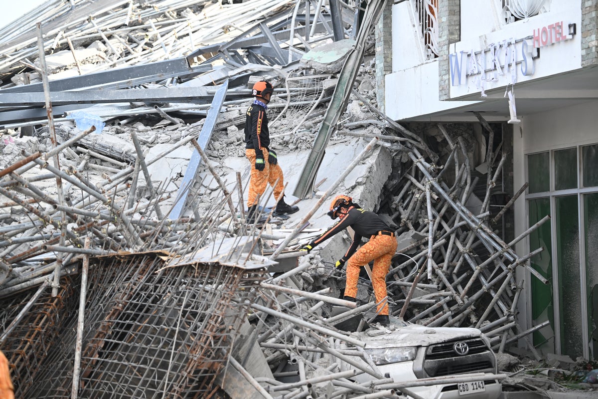 Philippines building collapse leaves 21 missing as rescuers hear voices from rubble
