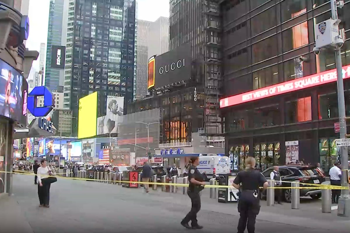 Woman shot dead by police in Times Square after fatally stabbing one and injuring another