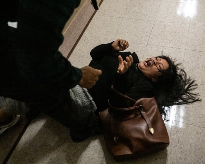 Ice officer ‘relieved of duties’ after video shows him manhandling woman at New York immigration court