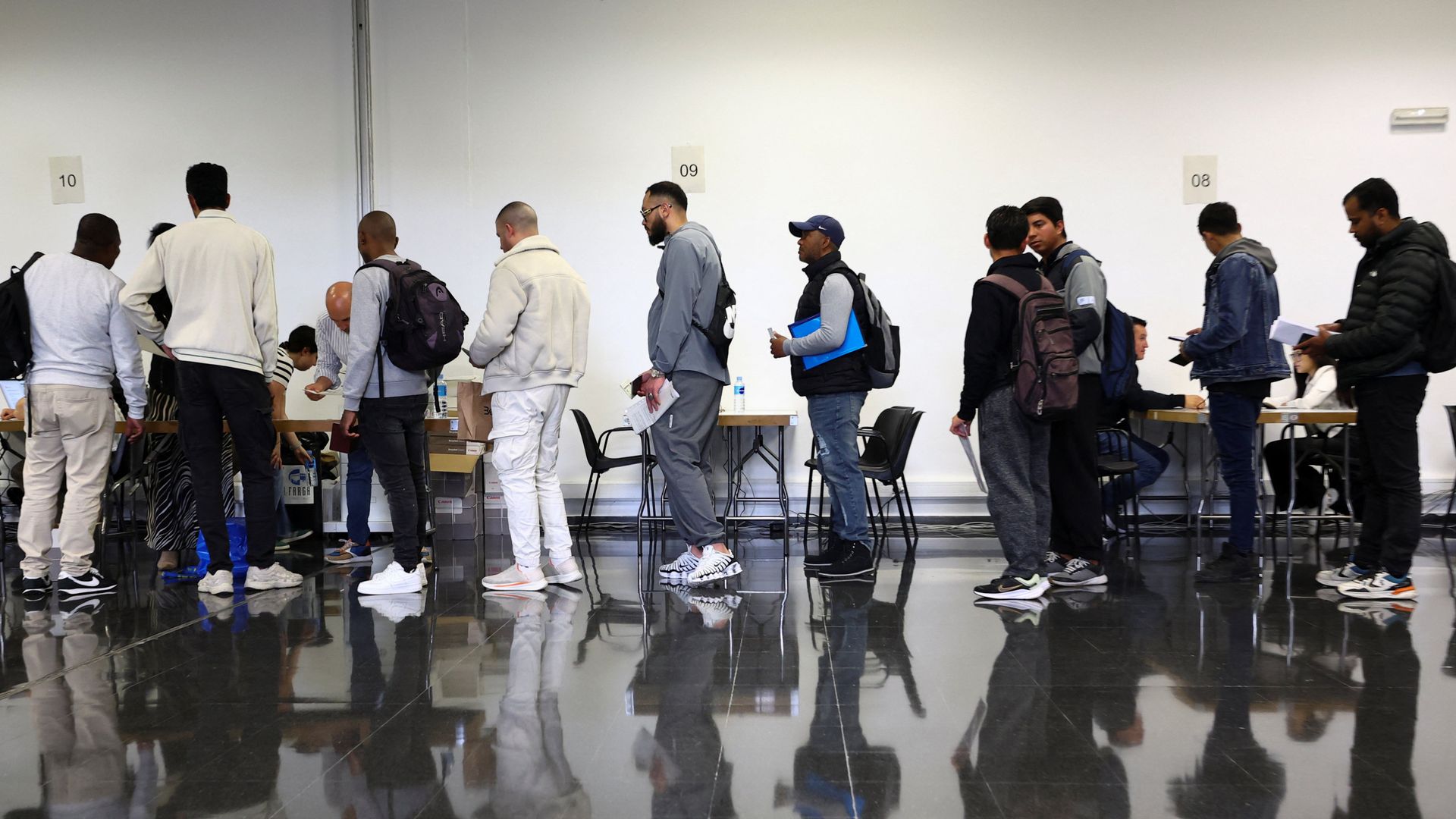 Migrants in Spain queue to apply for mass legalisation programme