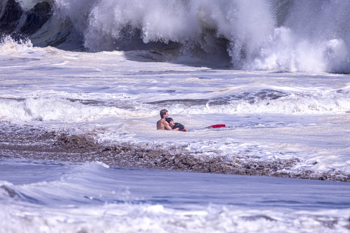 ‘What he did, I can never repay’: Dad hails teen who plunged into deadly surf to save son