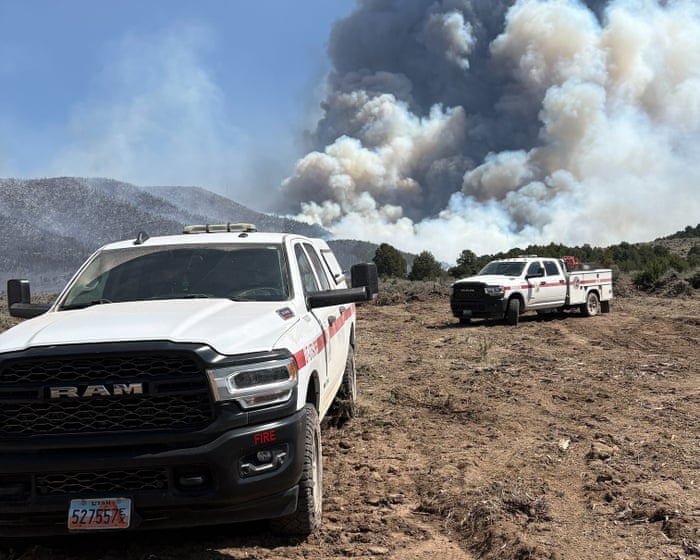 Utah wildfire forces evacuation of small town as extreme heat roasts US west
