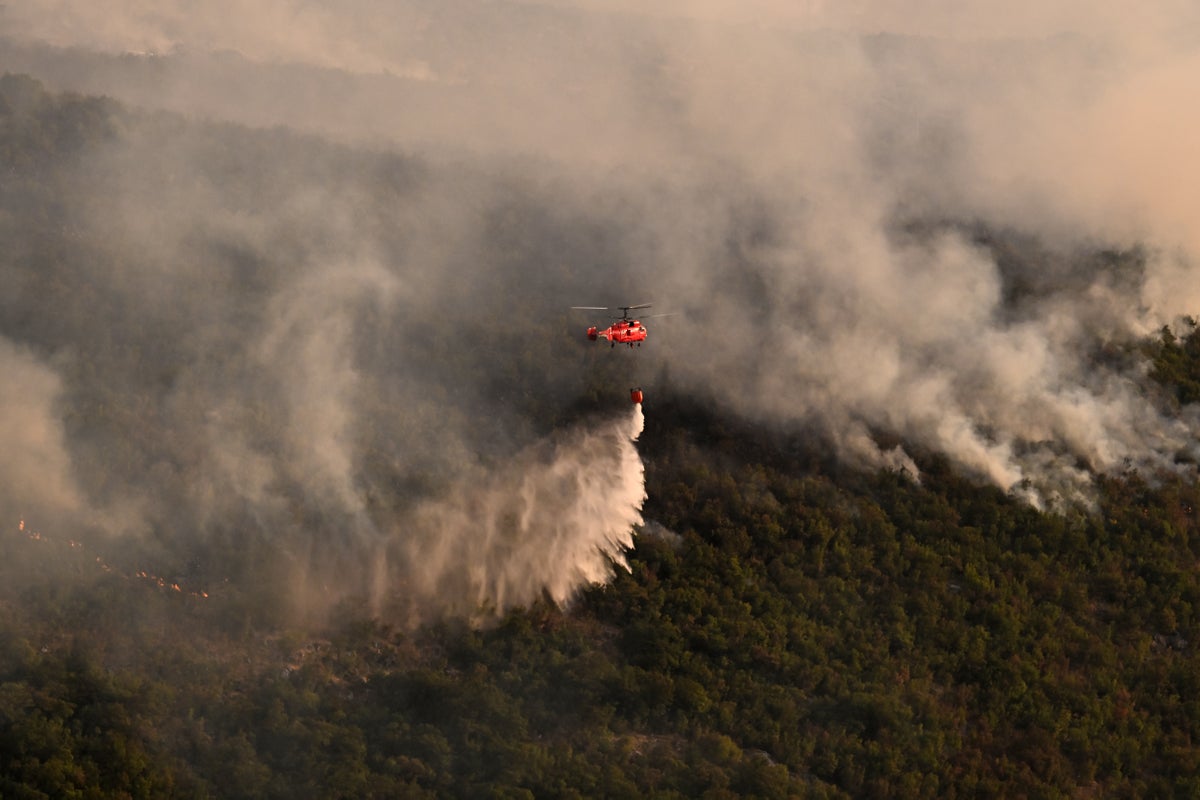 Wildfires spread as deadly heatwave moves across Europe
