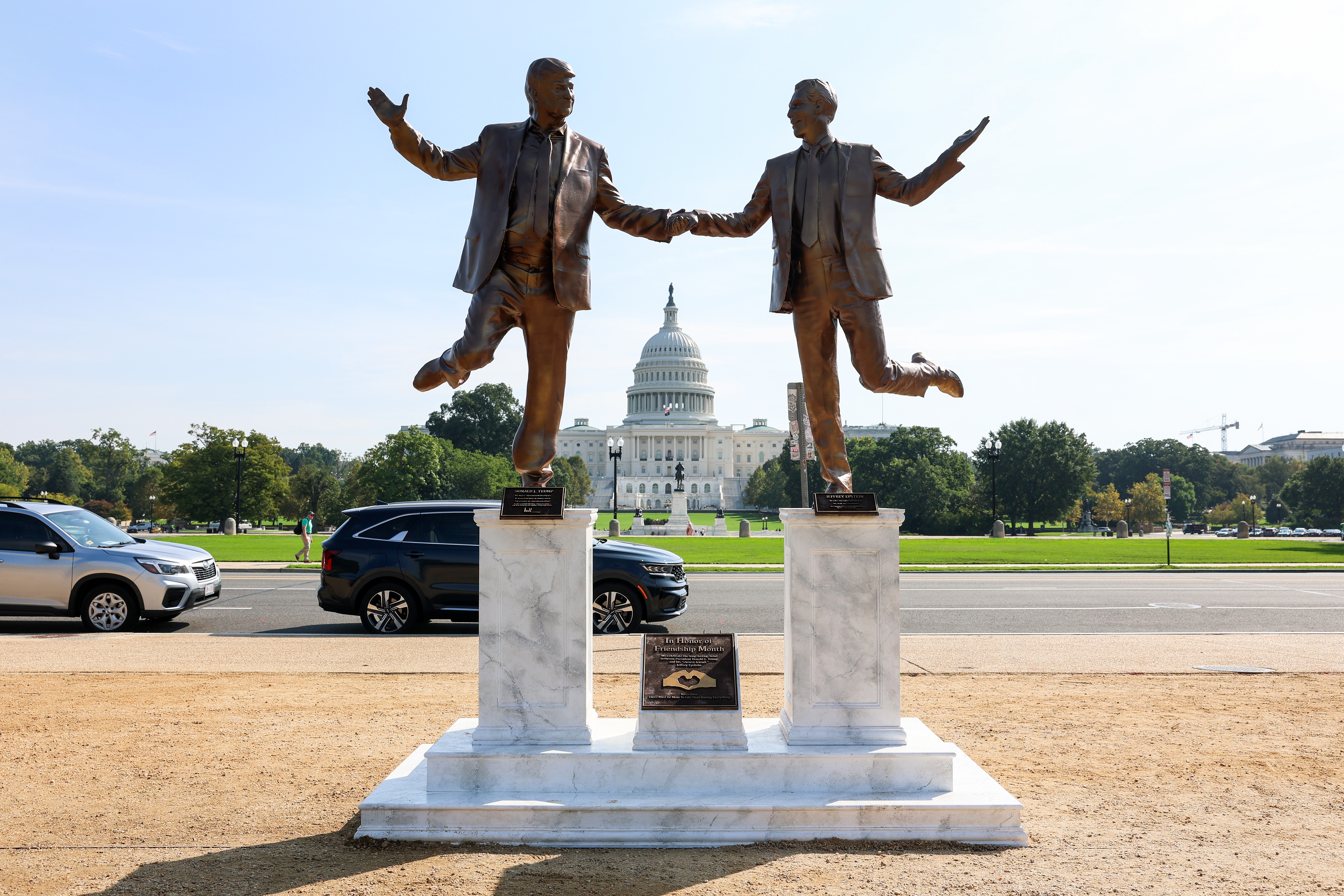 A statue of Trump and Epstein holding hands in D.C. is removed as fast as it appeared