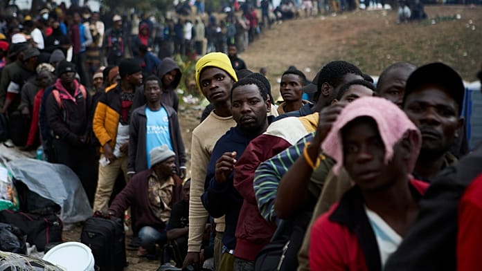 Thousands of migrants queue for repatriation in South African camps