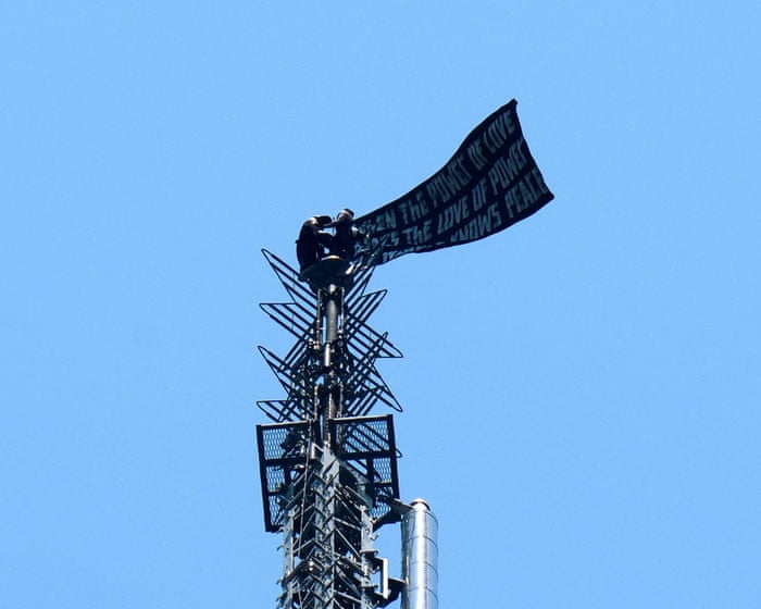 Two people unfold banner atop Empire State Building in apparent marriage proposal stunt