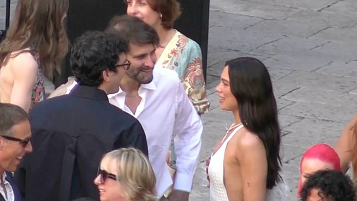 Dua Lipa and Callum Turner celebrate with guests at Sicily wedding party