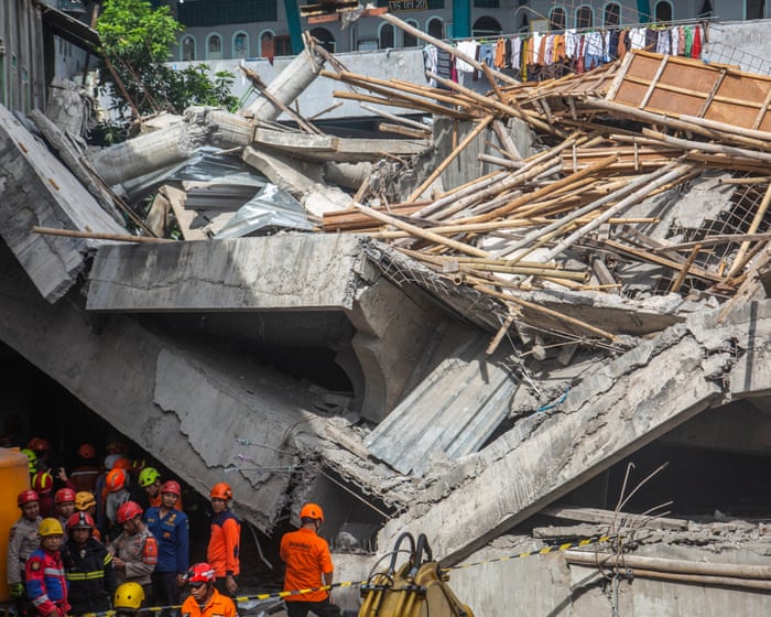 Indonesia school collapse: one dead, 65 buried under rubble as rescuers race to find survivors
