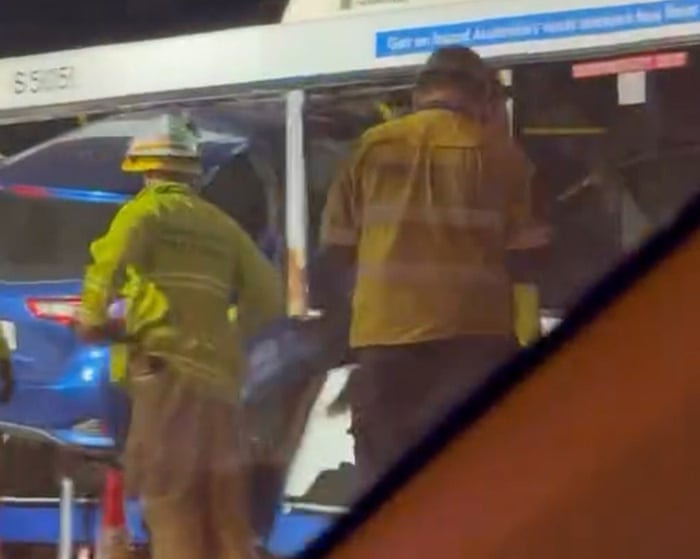 ‘A car in the bus!’: Toyota becomes airborne and then wedged in side of Brisbane bus