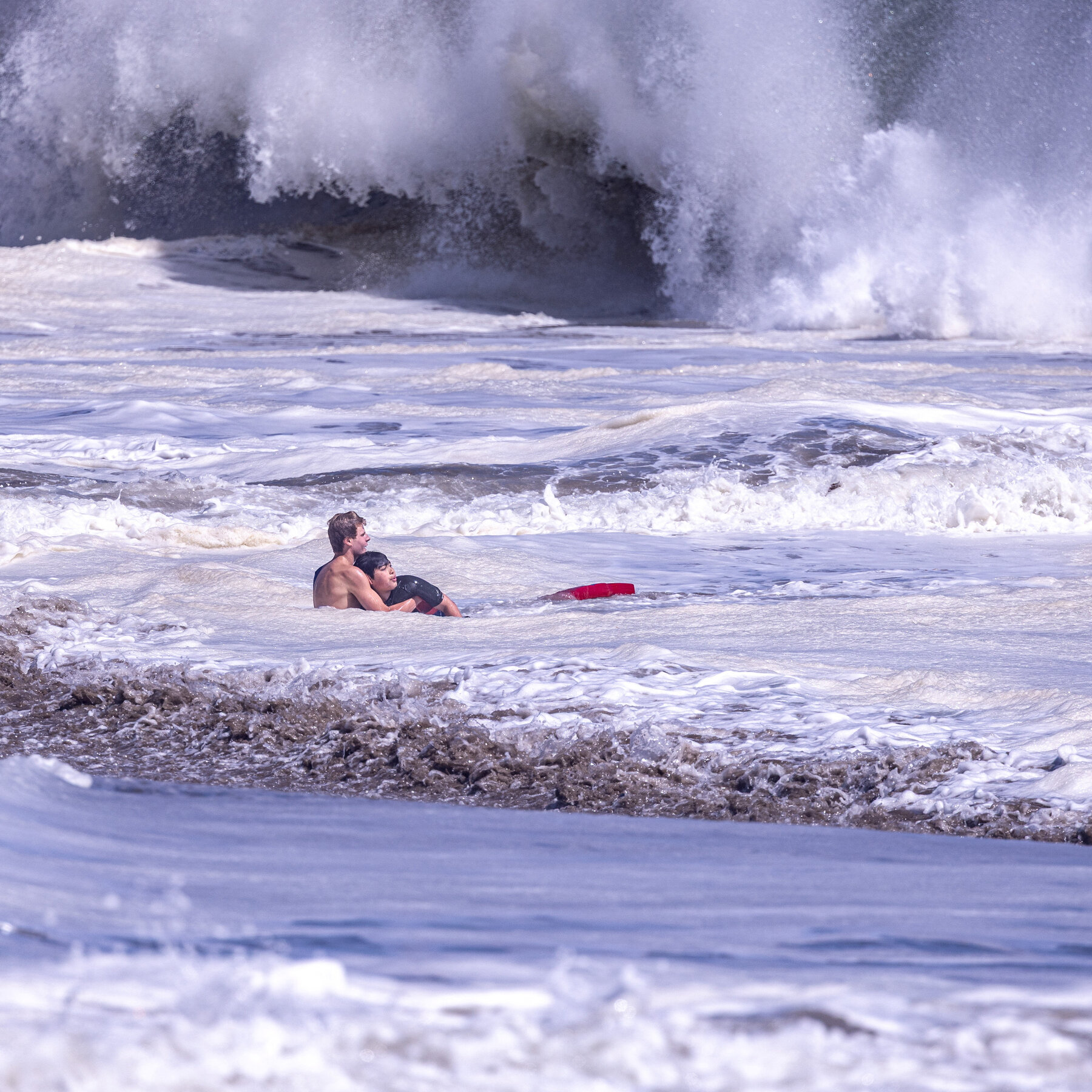 Teenage Lifeguard Fights Intense Waves to Bring Boy to Safety